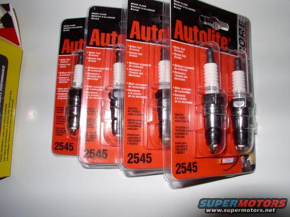 For a 1990 5.0 litre Town Car these are your Autolite plug #s (2545). I've fooled around with fancier, more expensive plugs, but frankly 5.0 litres love these plugs or Motorcraft plugs.  Stock gap on a Lincoln is .050". I gap them between .055 and .060, with an MSD coil.