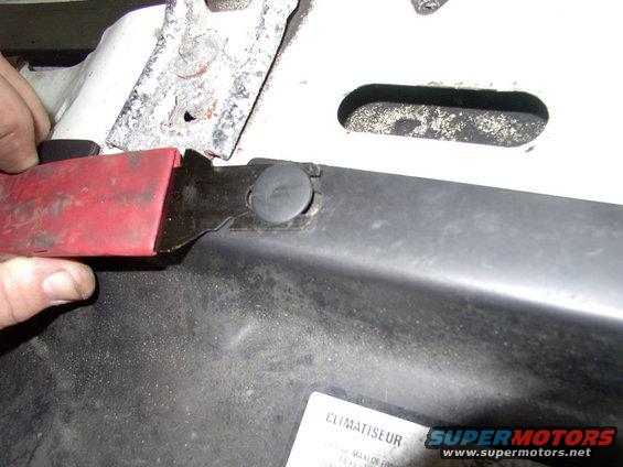 img_0067.jpg Just pop the six of these plastic clips out with a trim tool.