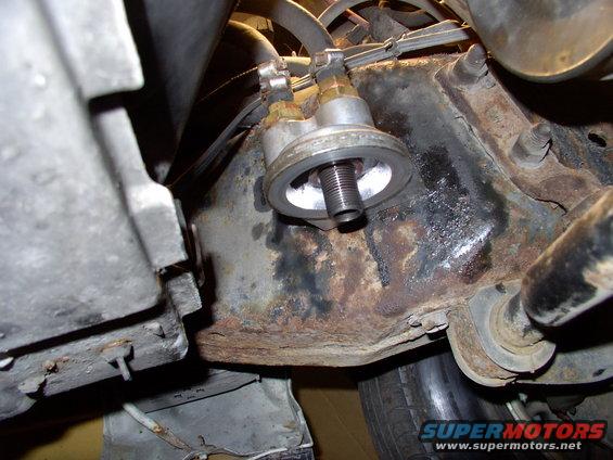 After the frame rail is drilled and tapped, just bolt the unit to the frame and run the hoses.