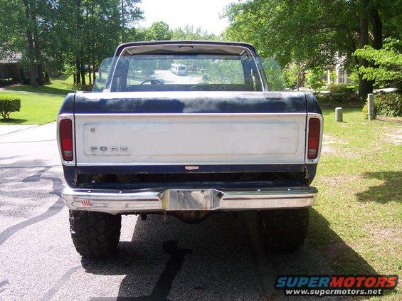 Rear view of a 1978 Ford Bronco with a dark blue and white paint scheme