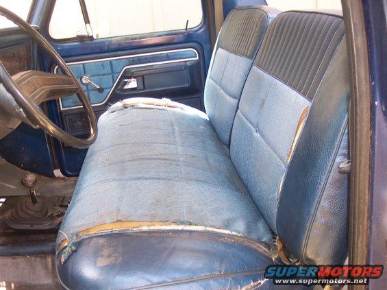 Blue interior with worn bench seat and dashboard details
