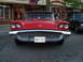 1990 Ford Thunderbird - Classic red 1959 Ford Thunderbird parked on a street, with another car visible to the right.