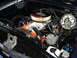 1990 Ford Thunderbird - Close-up view of a car's engine bay, showing the air cleaner and engine block.