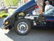 1990 Ford Thunderbird - A dark blue coupe is shown with its hood open, revealing the engine compartment and front wheel.