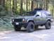 2000 Jeep Cherokee - This modified Jeep Cherokee, likely from the late 1990s, is equipped for off-road adventures.