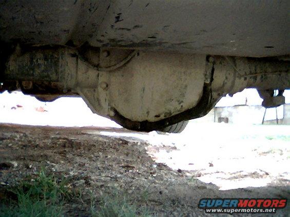 Underside view of a vehicle's rear differential and axle