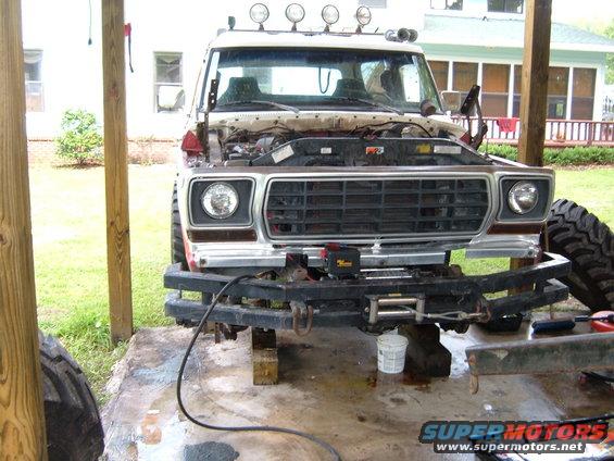 1978 Ford Bronco front end, hood open, showing engine bay and winch on bumper