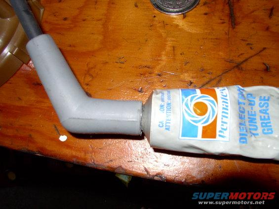 If you've ever torn off a plug boot or terminal you'll appreciate why I always load both ends of the plug wire with dielectric grease. It stops rip-offs happening and helps promote conductivity.