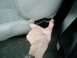 1992 Ford Bronco - A hand operates the seat adjustment lever inside a vehicle.