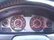2002 Nissan SE-R - The dashboard of a 2002 Nissan SE-R features prominent red-accented gauges for speed, RPM, fuel, and temperature.