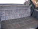 1995 Ford C-350 (Centurion Conversions) - Interior view of a velour bench seat with a patterned fabric design.