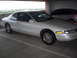 1994 Lincoln Mark VIII - A white 1994 Lincoln Mark VIII is parked in a garage, with another vehicle visible behind it.