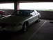 1994 Lincoln Mark VIII - A 1994 Lincoln Mark VIII is parked in a garage, with another vehicle partially visible to its left.