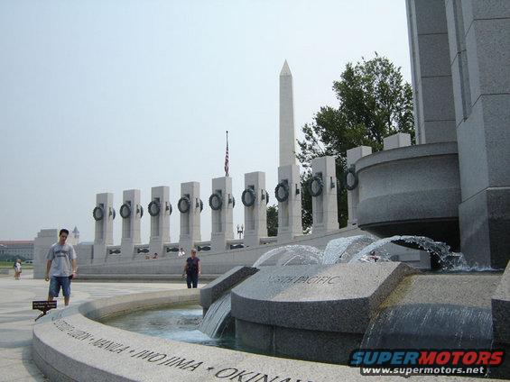 World War II Memorial with fountains and pillars, Washington Monument in background