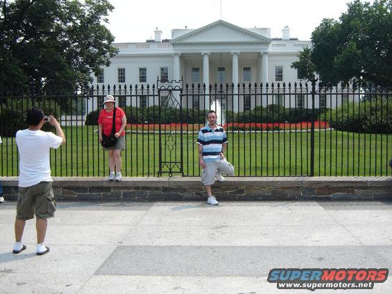 White House with tourists posing for photos