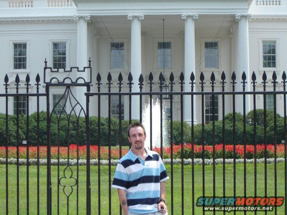 Man standing in front of the White House fence
