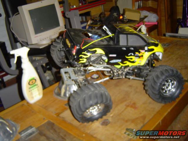 Black and yellow remote control monster truck with large tires