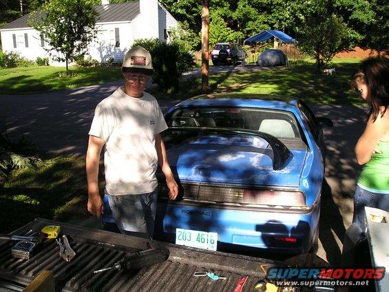 Blue 1984 Pontiac Fiero with a spoiler and a license plate reading 203 4616