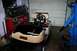 1989 Ford Bronco - EZGO golf cart with flame decals is parked in a garage next to a blue engine hoist.