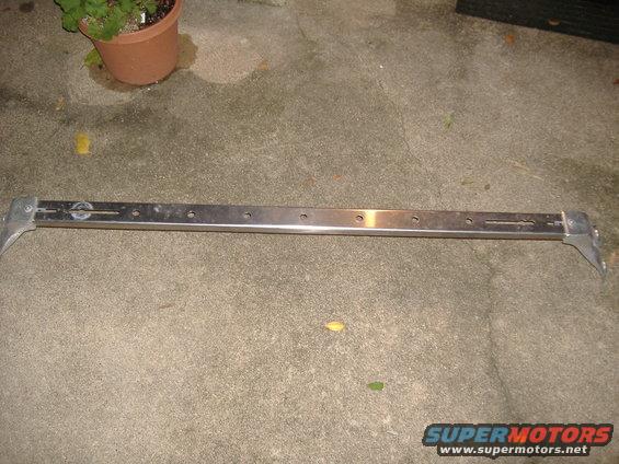 Metal bar with mounting brackets and multiple holes