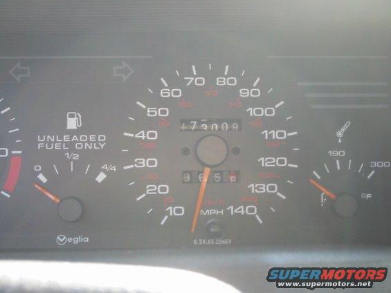 Dashboard gauges with a speedometer up to 140 MPH, odometer reading 73009, and fuel gauge