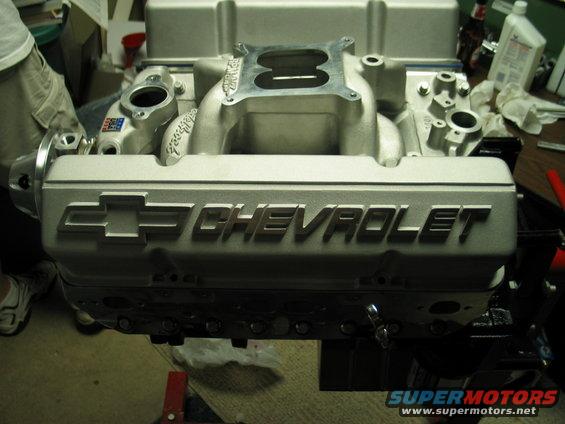 Close-up of a Chevrolet engine intake manifold with the Chevrolet logo visible