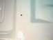 1966 Ford Fairlane - A small dark spot is visible on a white painted surface, possibly a car part.