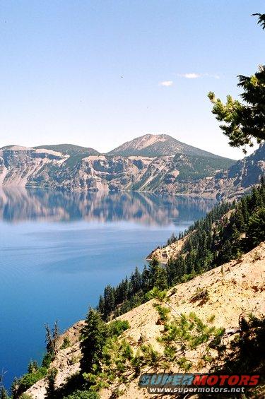 Crater Lake landscape with mountains and blue water