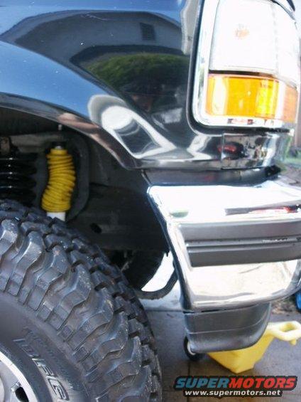1996 Ford Bronco front fender, tire, and bumper detail