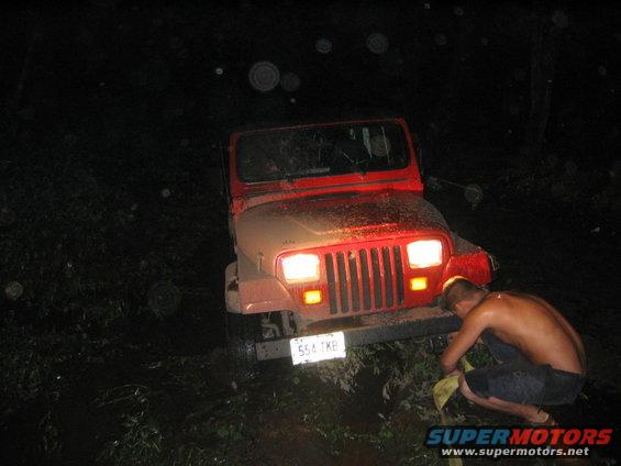 dan-stuck1-001.jpg Jeep stuck almost half way up the rear wheels. Only one side bad 