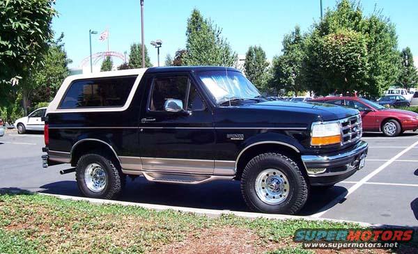 Black Ford Bronco with tan trim parked outside