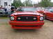 1978 Ford Mustang II - Front view of a red 1978 Ford Mustang II at an outdoor gathering.