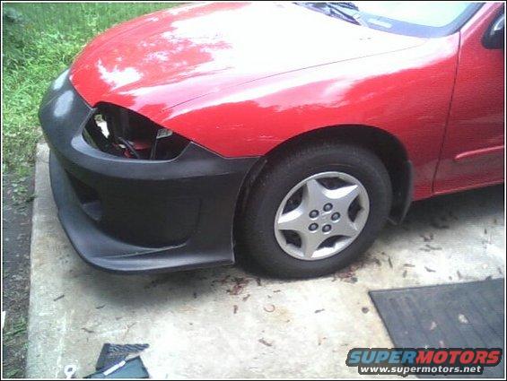 Red 2005 Chevrolet Cavalier with a black aftermarket bumper and a missing headlight