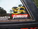 1988 Ford Bronco - Window stickers for Flowmaster and The Web Wheeler are visible on the side of a vehicle.