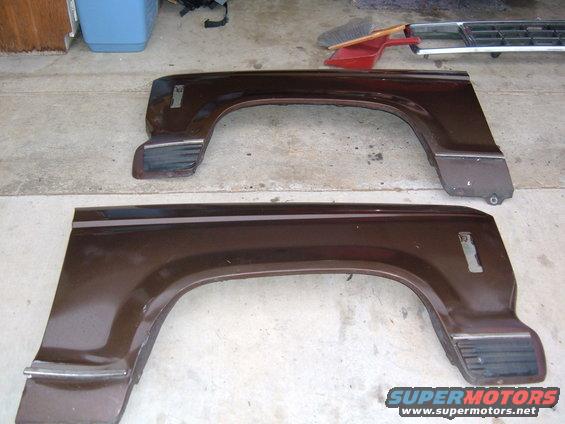 two brown fender flares with chrome trim and amber reflectors