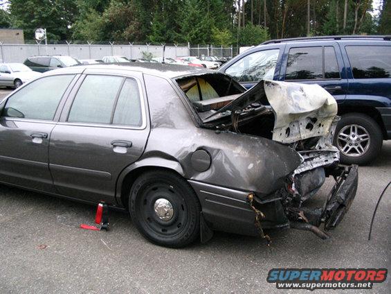 Side of the Trooper's slick-top. This unit has had the 2003 recall "fix" from Ford which takes care of the rear end collision fire problem.  The trooper and was in the driver's seat and a subject was in the back seat when the collision happened and the fire started. The trooper, although injured, rescued the prisoner and both survived. This was the second rear-end collision from drunks in a two week period for the state. The first driver was not caught. The moron in this one was.