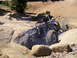 1989 Ford Bronco - A custom off-road buggy tackles a challenging rocky trail.