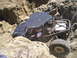 1989 Ford Bronco - A modified buggy navigates a rocky off-road course.