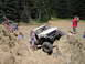 1989 Ford Bronco - Off-road enthusiasts tackle challenging rocky terrain with modified SUVs.