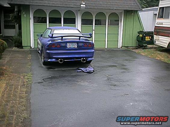 1993 Ford Probe rear view, blue with spoiler and dual exhaust pipes