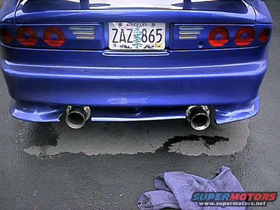 blue car's rear bumper, dual exhaust pipes, and Oregon license plate ZAZ 865
