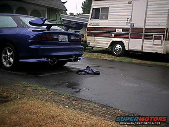 Blue 1993 Ford Probe rear view with spoiler and dual exhaust