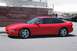 1997 Ford Probe - Side profile of a red 1997 Ford Probe coupe parked outdoors.