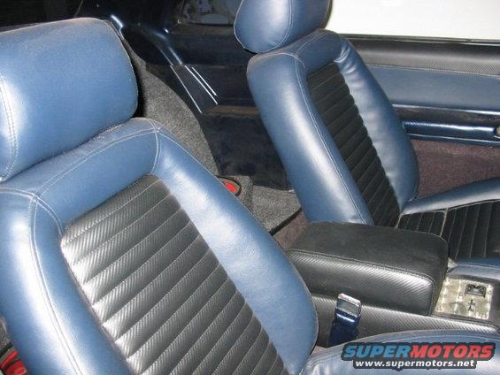 Blue and black interior with bucket seats and center console