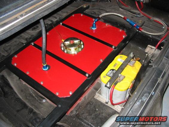 Custom red fuel cell and yellow Optima battery installed in a car's interior