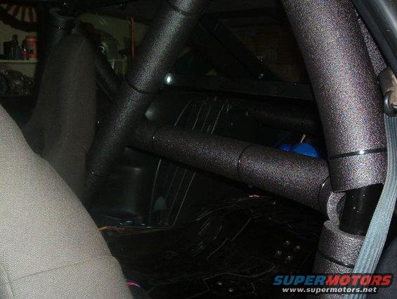 Interior view of a car's roll cage and seats