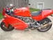 1985 Ford Bronco - A red Ducati Supersport 900 motorcycle is parked outdoors on a concrete surface.