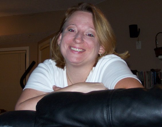 Woman smiling, indoors
