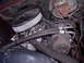 1992 Ford F-150 - Close-up view of an engine bay, a chrome air cleaner and various hoses and components.