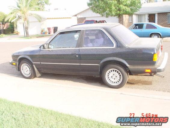 Dark sedan side view, 1992 model year indicated by body style